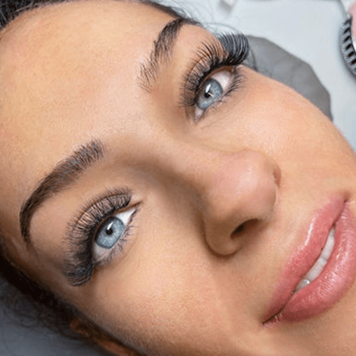 Close-up of woman's face with a full set of lash extensions