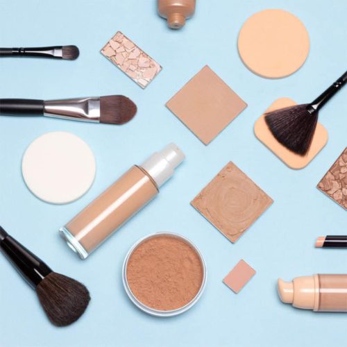 Assortment of beauty products to apply beach day makeup