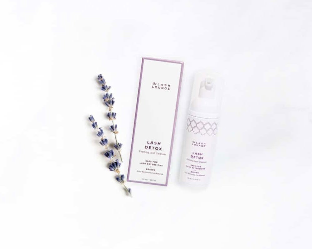 The Lash Lounge’s Unscented Lash Detox foaming cleansers lying on a marble counter.
