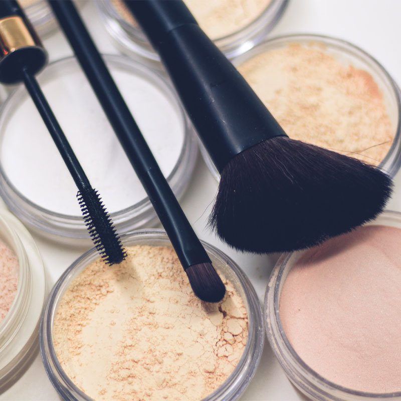 Powdered makeup and brushes