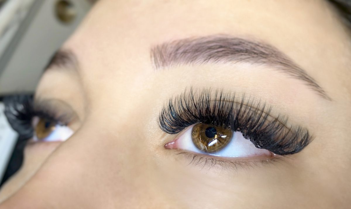 close-up of hispanic woman eyes with extreme volume lash extensions