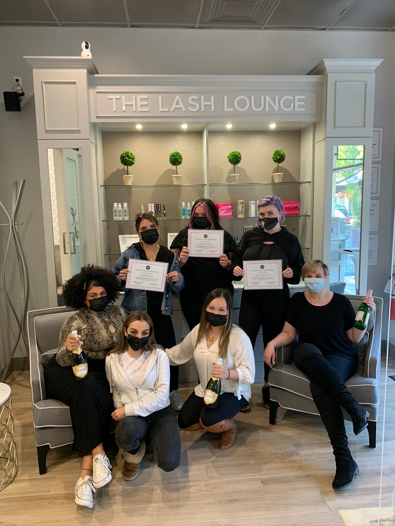 The Lash Lounge Summit – Downtown's staff posing together as a group.