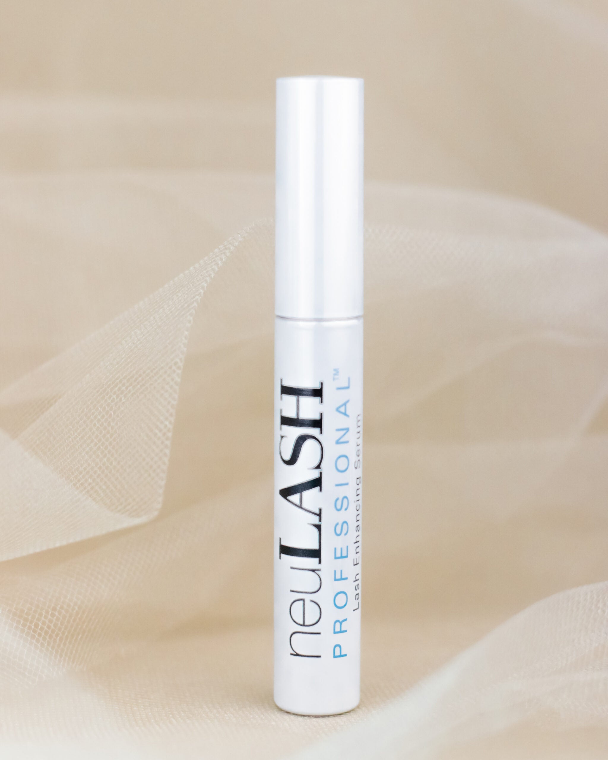 Lash serum for lash growth in front front of neutral background