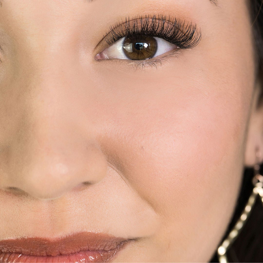 close-up of woman's face with a full set of lash extensions