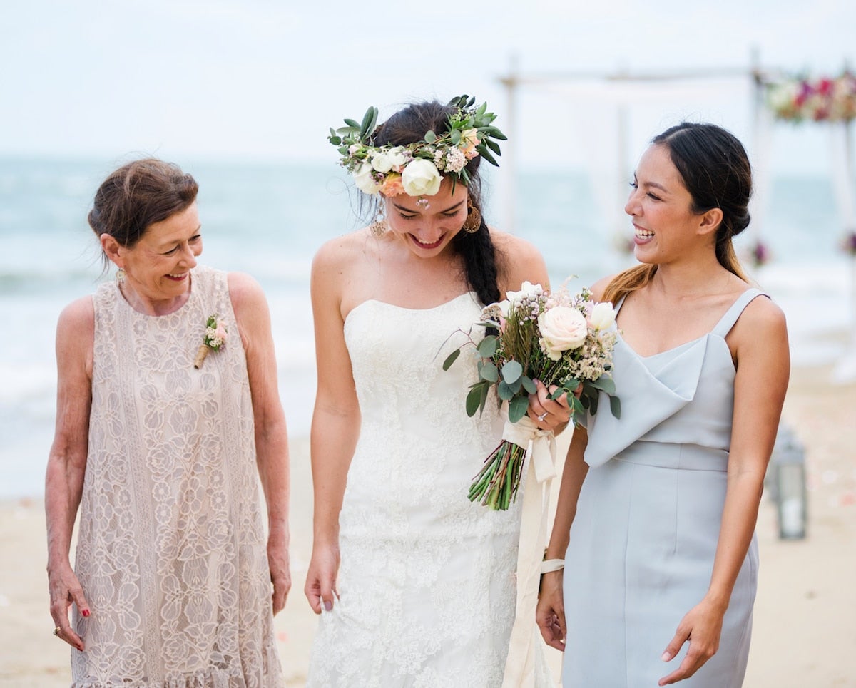 bride on beach with her mother and a bridesmaid