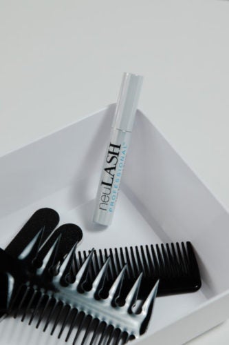 square dish with comb and lash growth serum for eyelash extensions