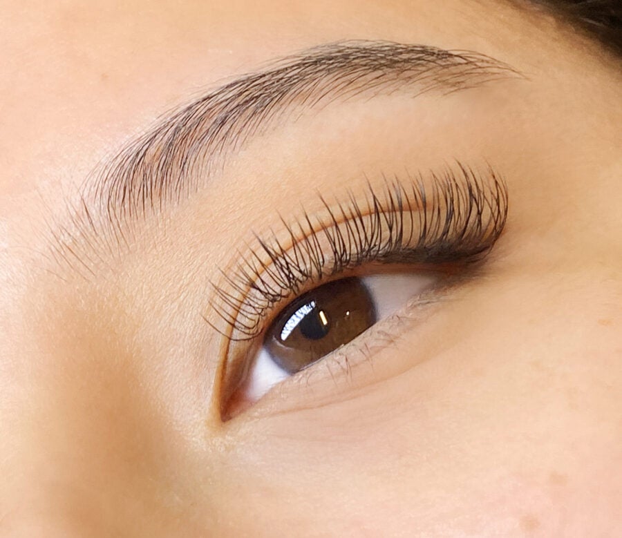 close-up of woman's open eye with classic lash extensions