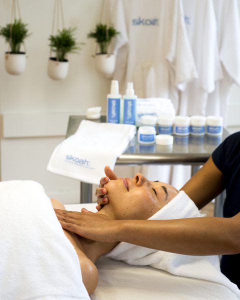 woman getting custom skoah facial massage