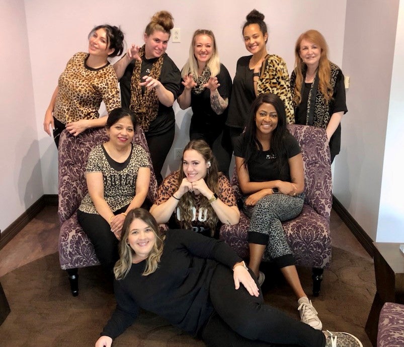 The Lash Lounge Plano – Shops at Legacy's staff posing together as a group.