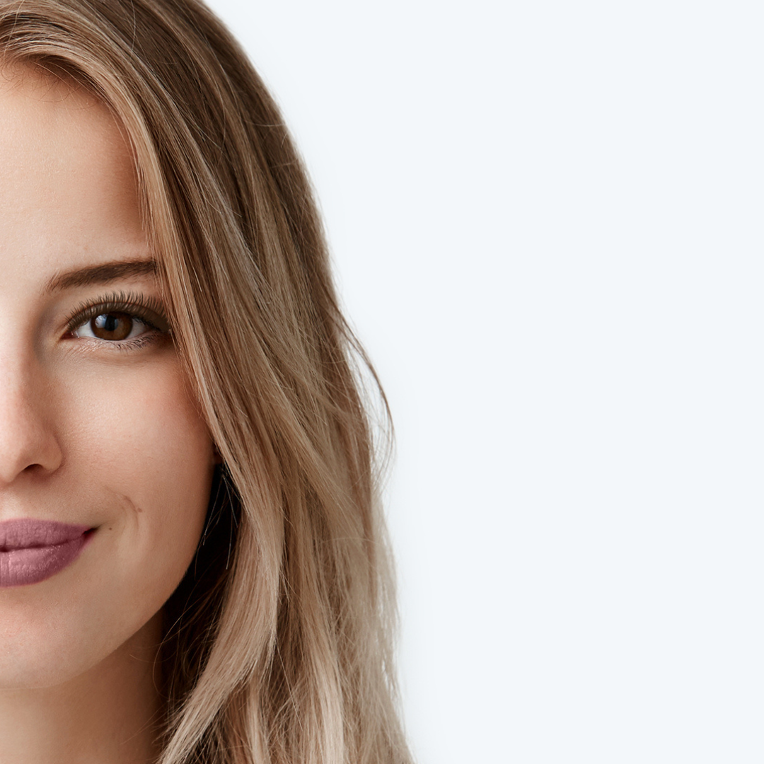 half shot of blonde woman's face with an eyebrow tint