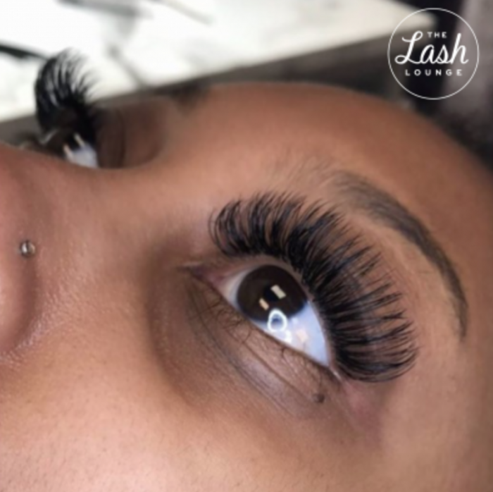 close up of woman with fresh lash extensions from The Lash Lounge