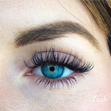 closeup of a radiant blue eye with lash customization from The Lash Lounge