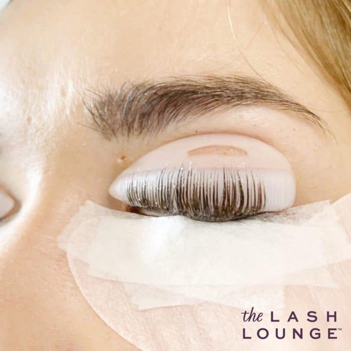 a lash lift in process by a stylist from The Lash Lounge