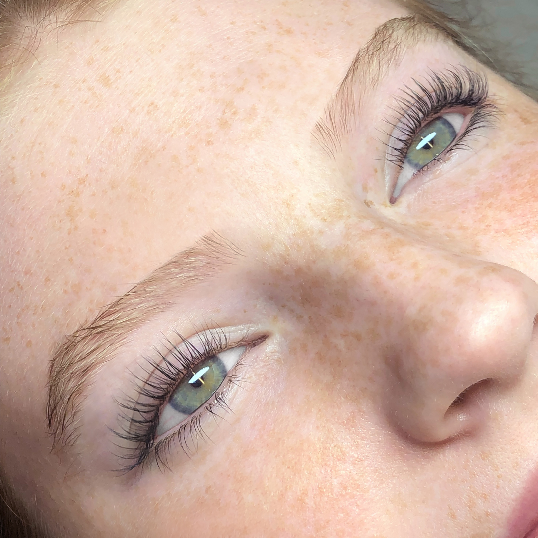 close-up of young woman's eyes after receiving a lash lift