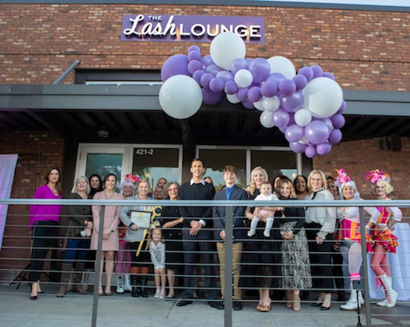 The Lash Lounge New Orleans — Mid City salon exterior with the owners and home office employees surrounding for the grand opening