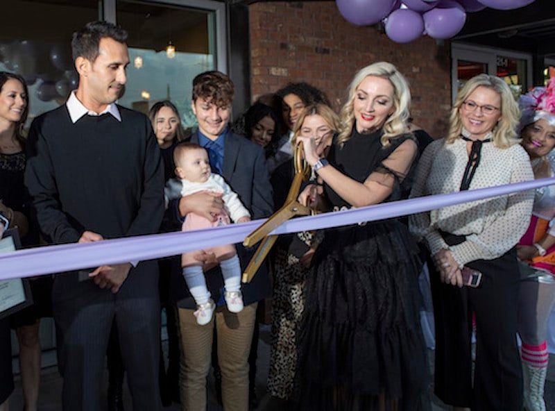 The owner of The Lash Lounge New Orleans — Mid City cutting the grand opening ribbon to her salon
