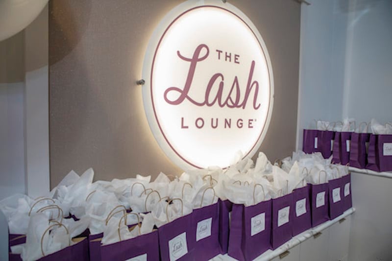 gift bags sitting on a table at The Lash Lounge New Orleans — Mid City grand opening