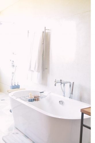 White bathtub in a bathroom with silver faucet