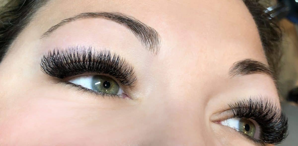 photo of a guest with volume lash extensions and green blue eyes from The Lash Lounge