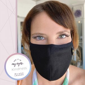 woman in mask with short hair and eyelash extensions