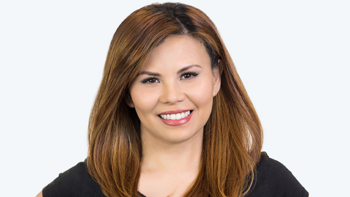 close-up of happy woman smiling with hybrid eyelash extensions