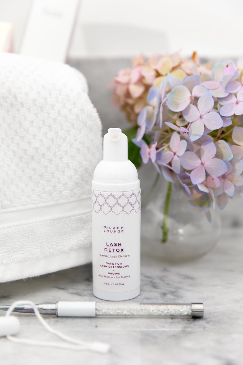 Photo of The Lash Lounge's Lash Detox foaming lash cleanser on a marble vanity