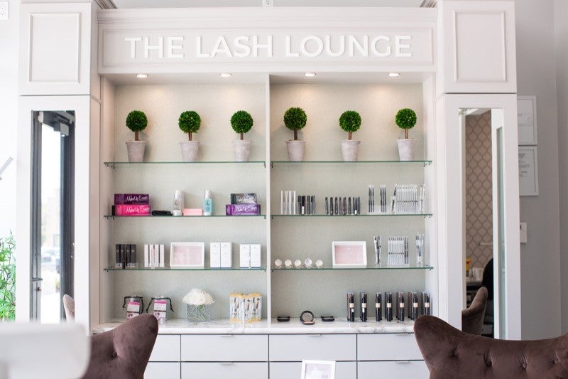 The Lash Lounge product wall in the salon