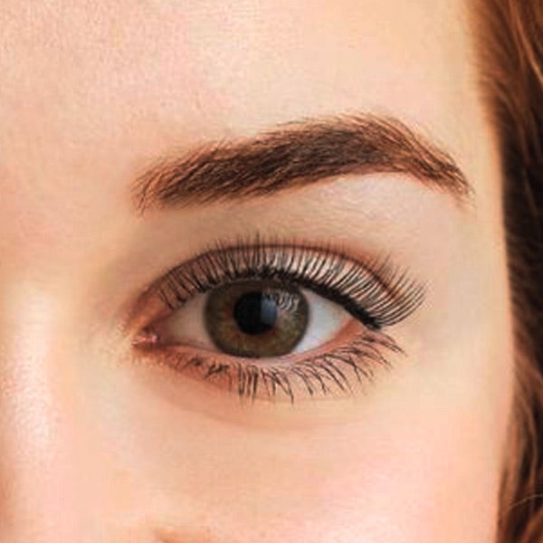 close up of a woman's eye with eyelash and brow services from The Lash Lounge