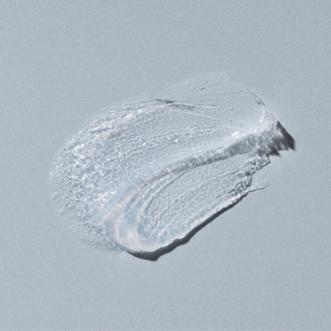 smear of Vaseline on grey background