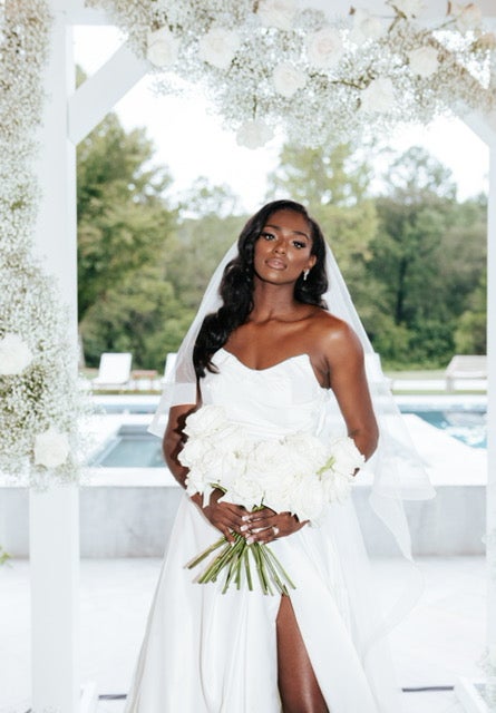 Lifestyle influencer, Nikki Baize, posing on her wedding day.