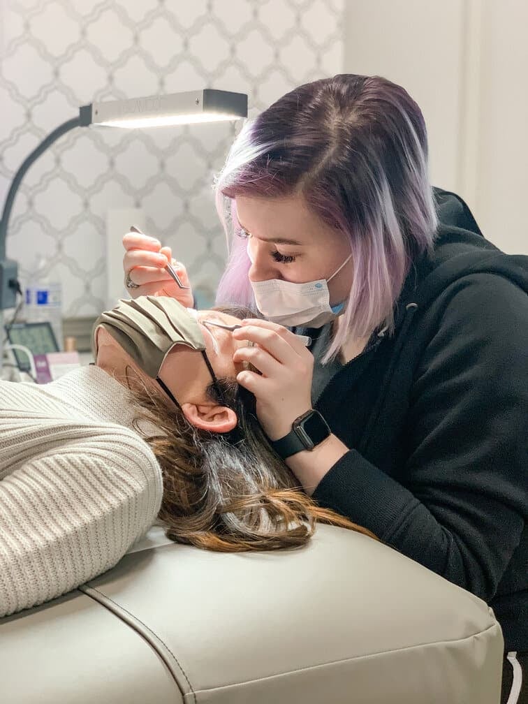 Lash Lounge stylist performing eyelash extension job