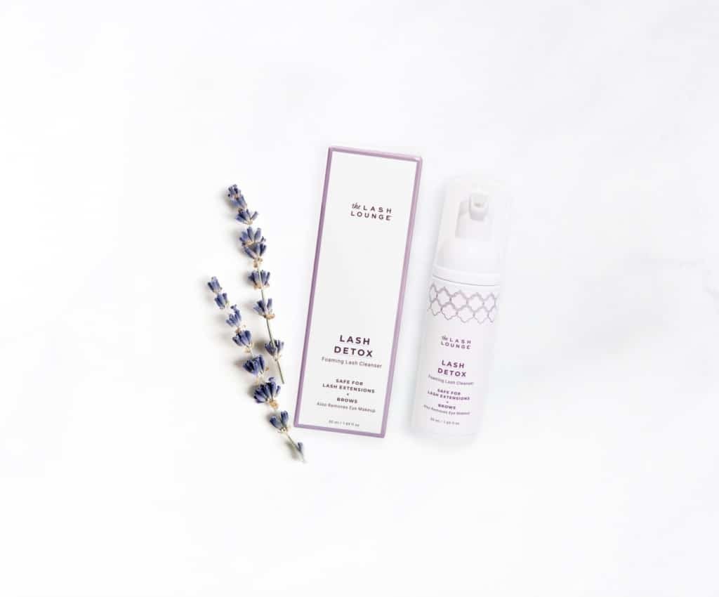 The Lash Lounge’s Unscented Lash Detox foaming cleansers lying on a marble counter.