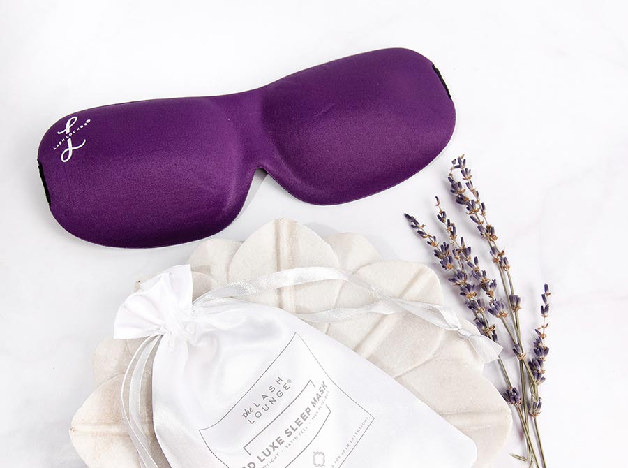 The Lash Lounge's 3D Contoured Sleep Mask laying down on a marble counter.