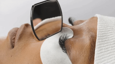 side view of woman's face during a lash refill