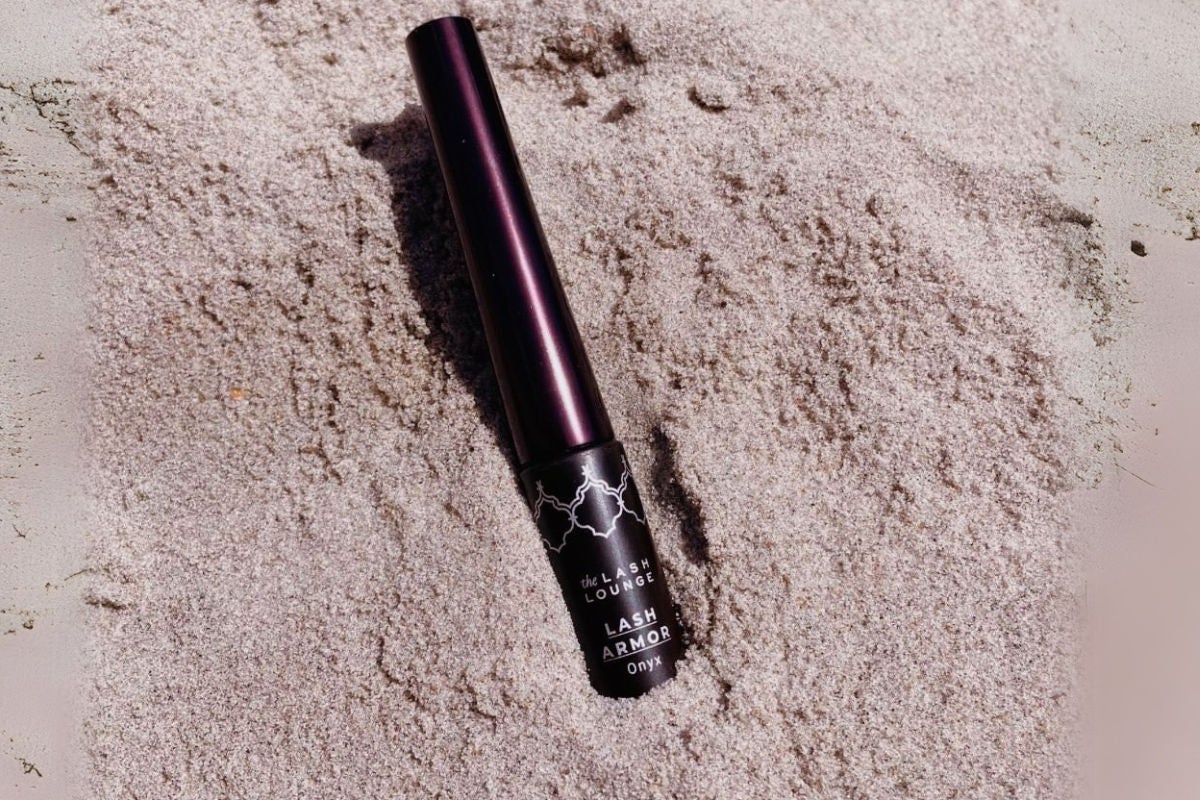 tube of Lash Armor sealant in sand