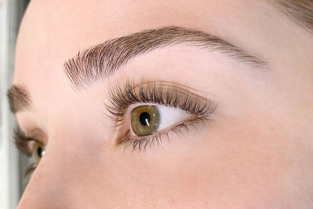 closeup of woman's eye area after brow threading