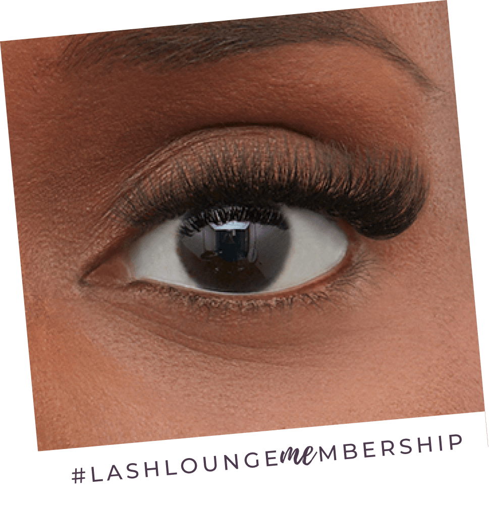A closeup of an eyeball with lash extensions used to highlight The Lash Lounge’s membership offer.