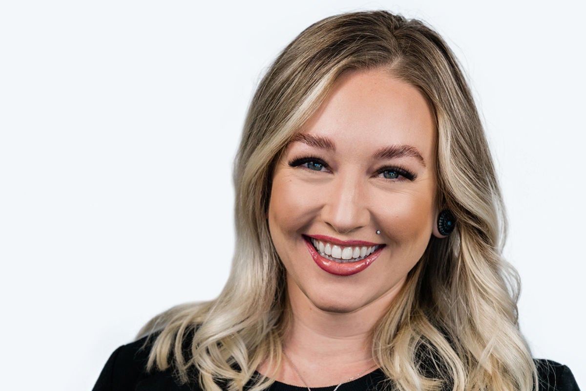 mid-shot of smiling blonde with laminated eyebrows