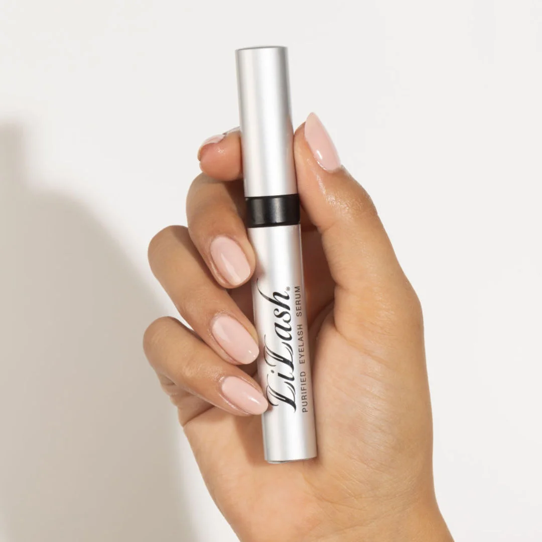 hand holding a lash serum