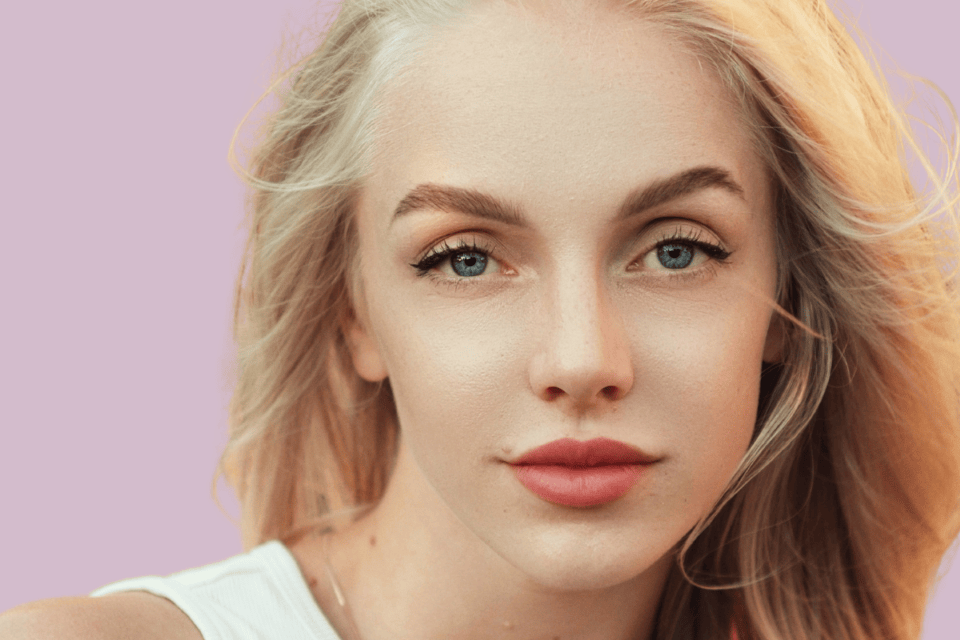 close-up blonde woman tinted brows