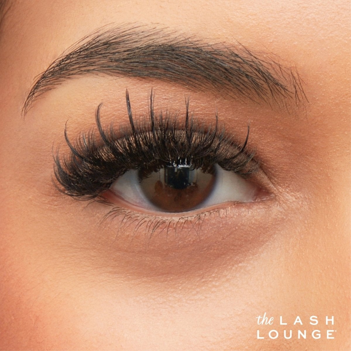 Close-up image of brown eye with spiky, or Manga, lash extensions.
