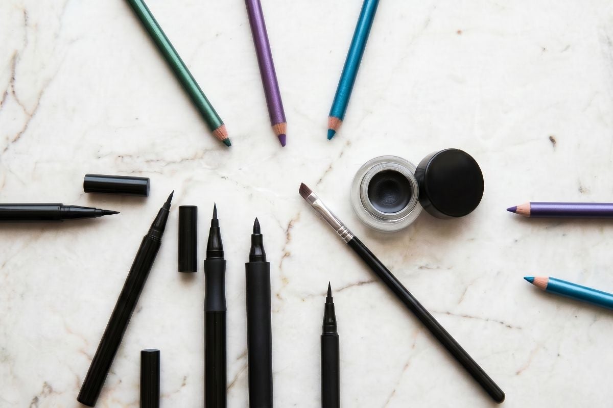 Display of different eyeliner products on countertop.